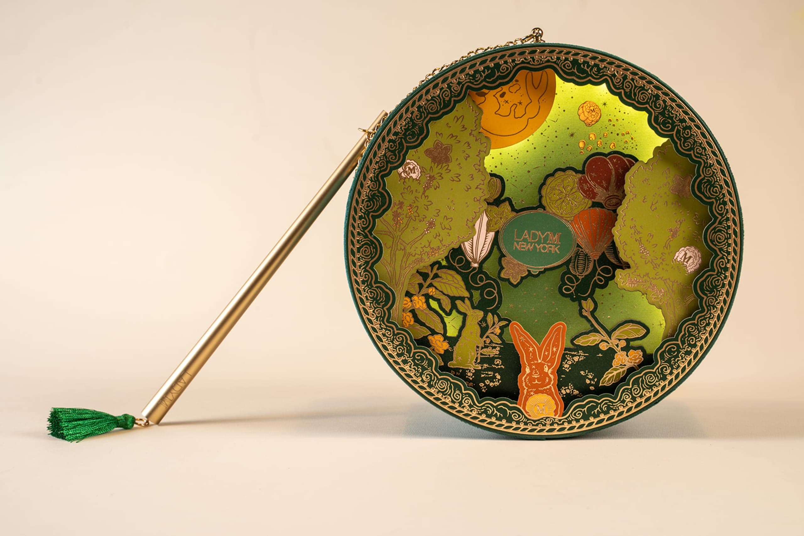 Lady M illustrated decorative mooncake box on a display stand