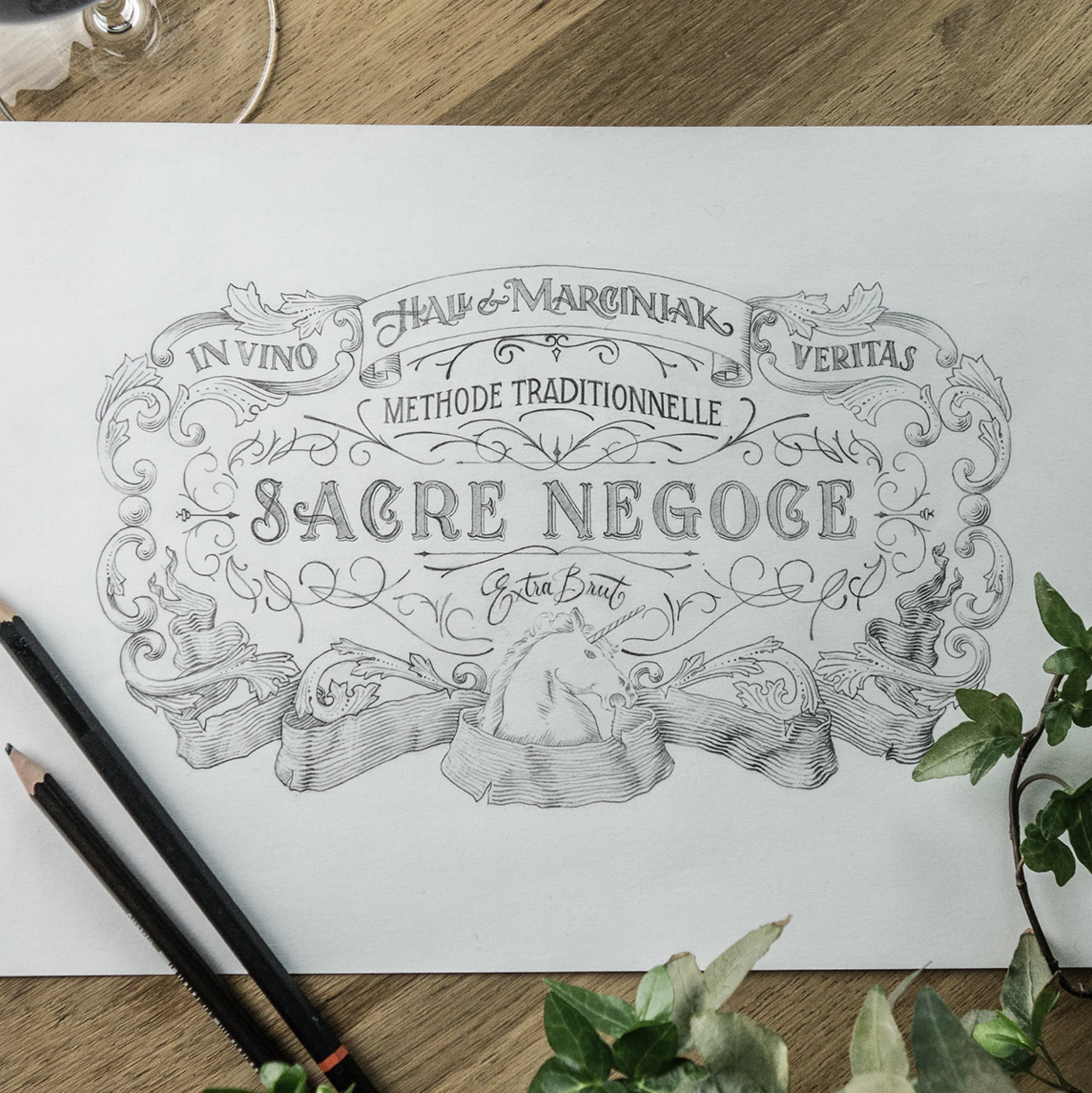 sacré négoce label sketch on a table