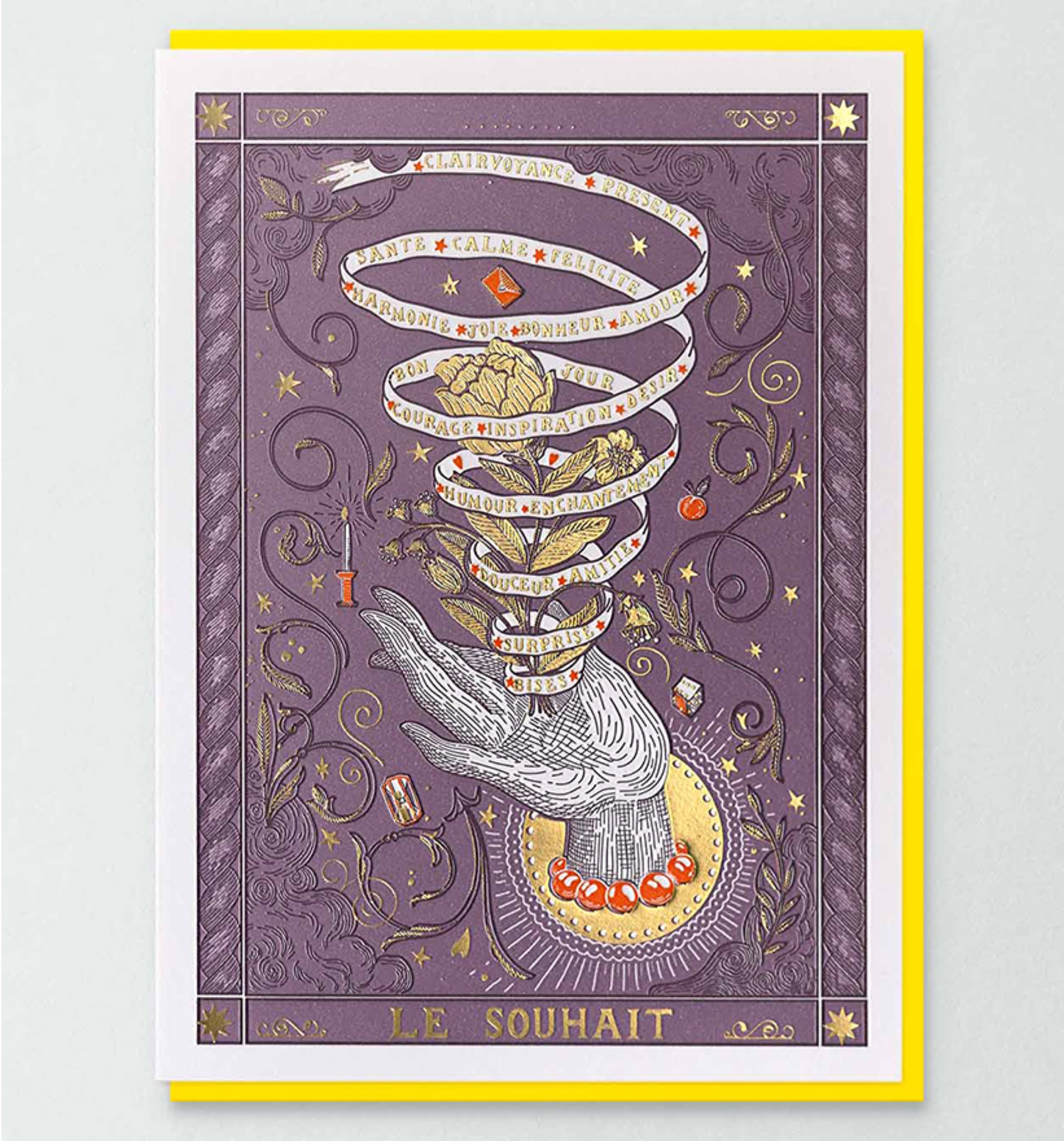 Purple greeting card with engraved upturned hand, gold foil ribbon spiral, and botanical crown.
