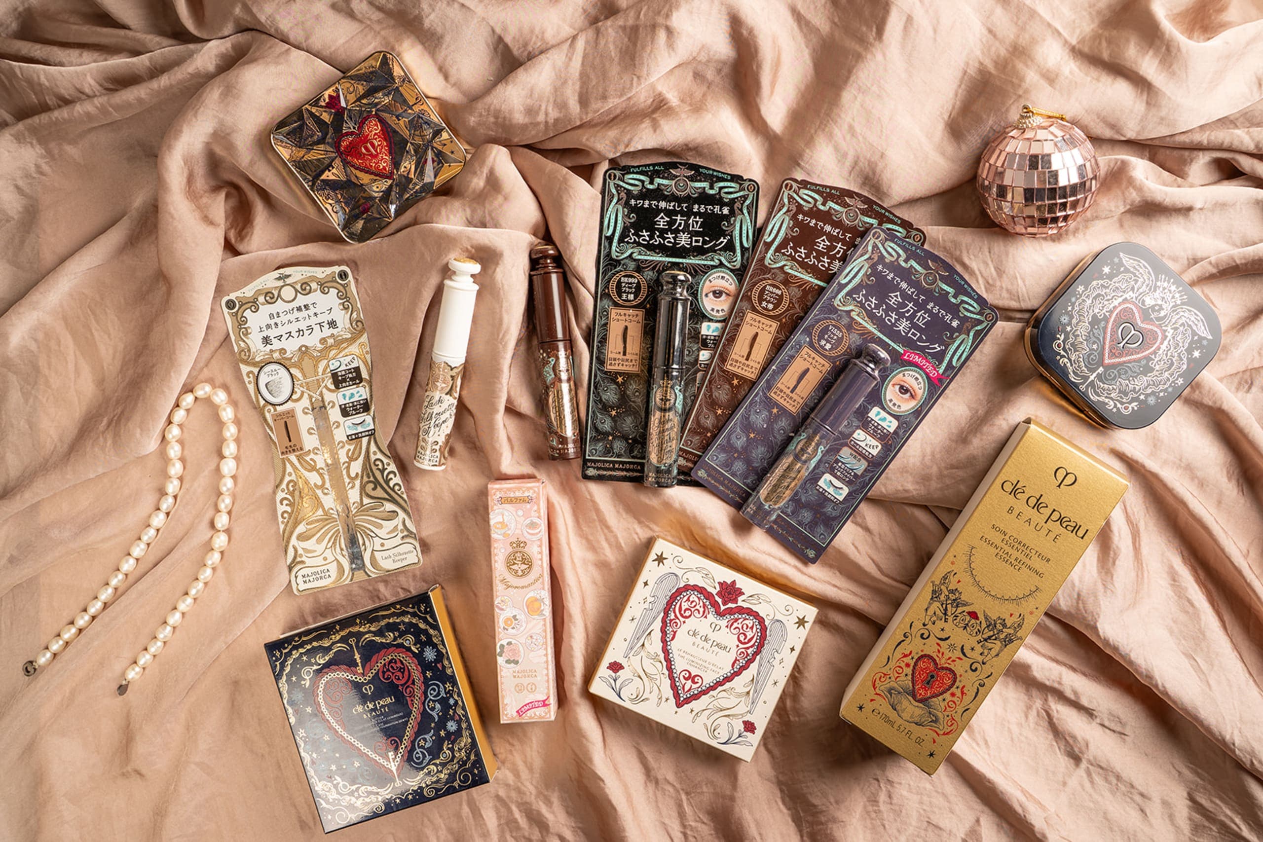 Majolica Majorca illustrated cosmetic collection on a silky surface