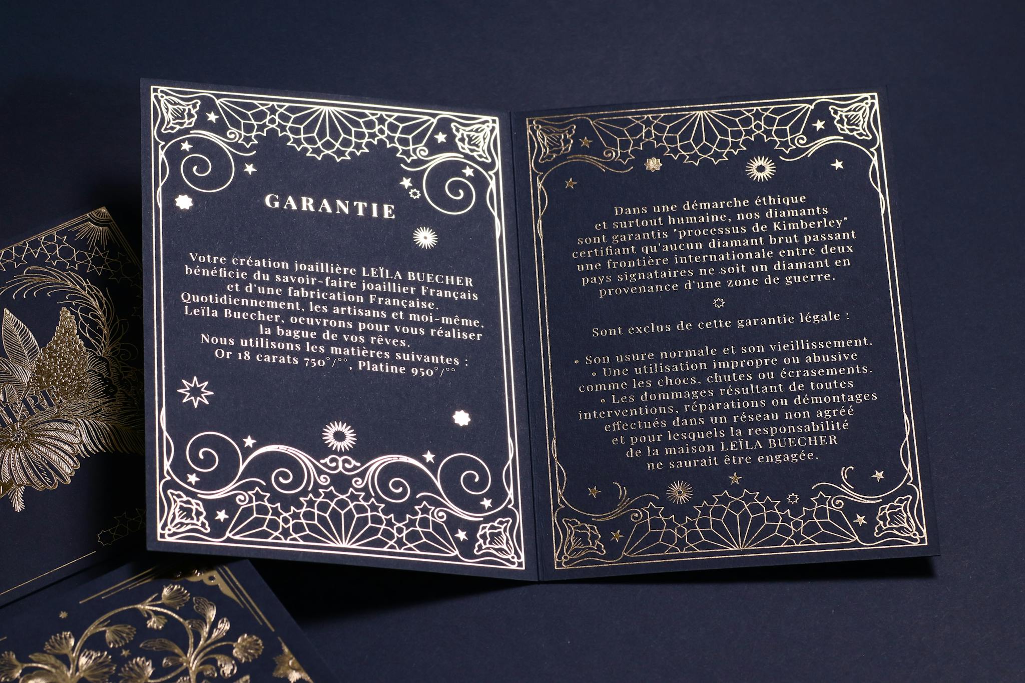 Picture of the blue and gold Leïla Buecher's guarantee card.