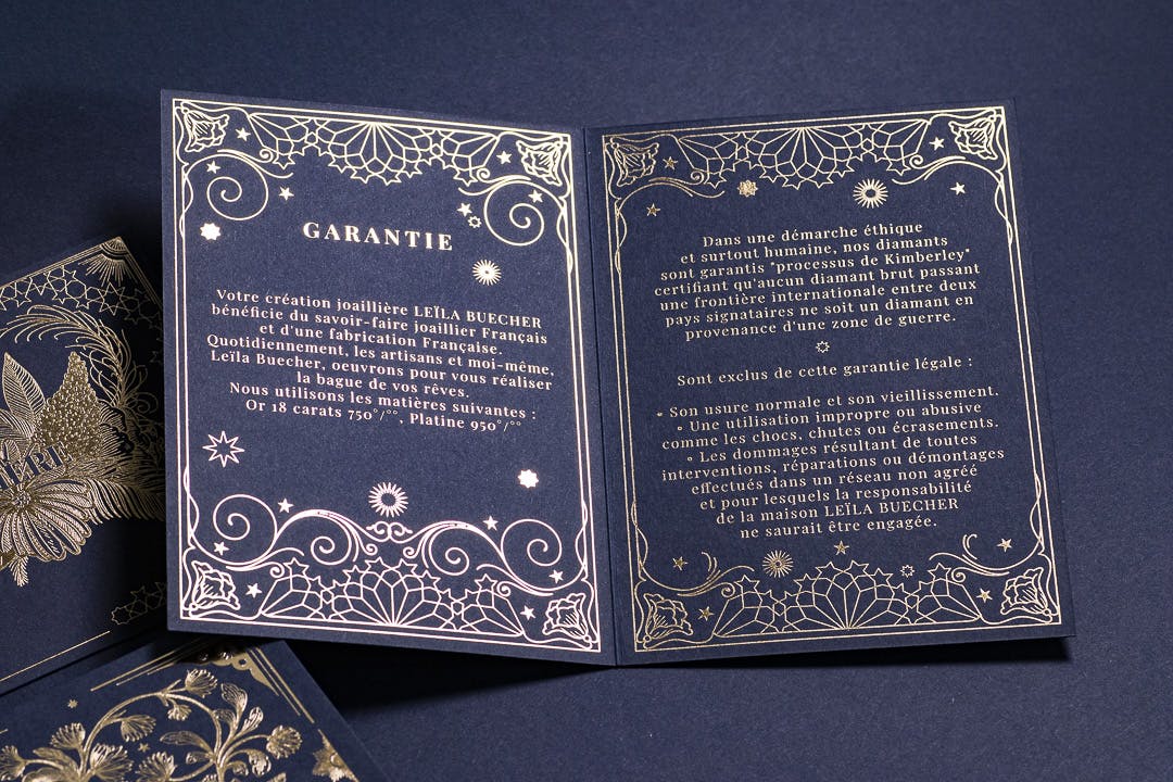 the inside of the guarantee card. Arabic inspired pattern and golden stars