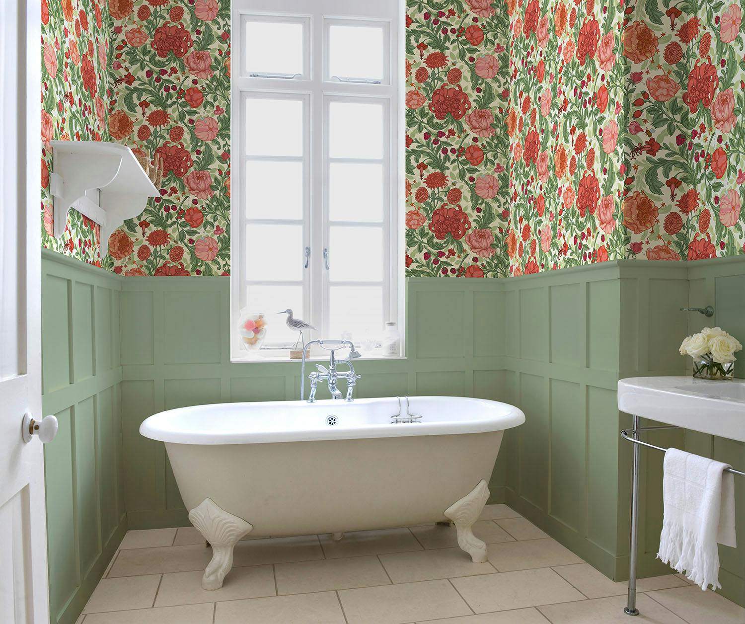 l'envolée lyrique set into a bathroom in a soft shade of almond green